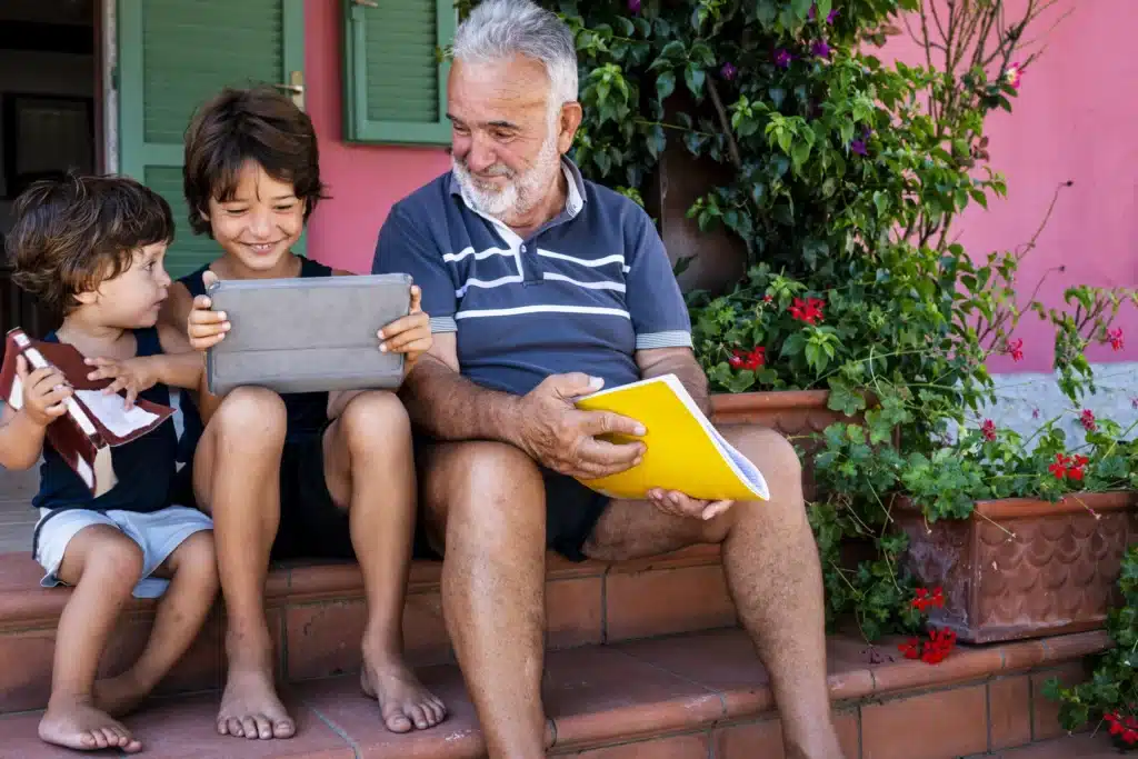 A grandfather spends time with his grandchildren after having had a minimally invasive procedure to treat from venous ulcers.