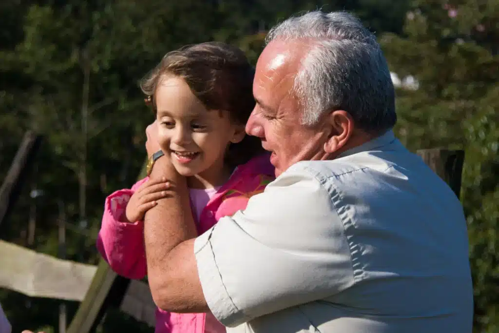 A grandfather spends time with his grandchild after having had a minimally invasive procedure to treat from venous ulcers.